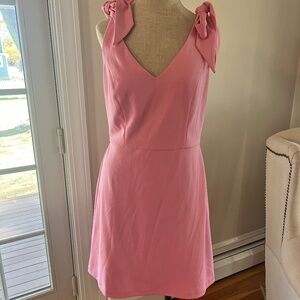Worn only once! BCBG size 8 pink mini dress with adjustable bow straps.
